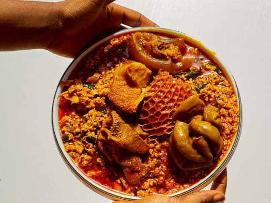 A bowl of egusi soup with assorted meat