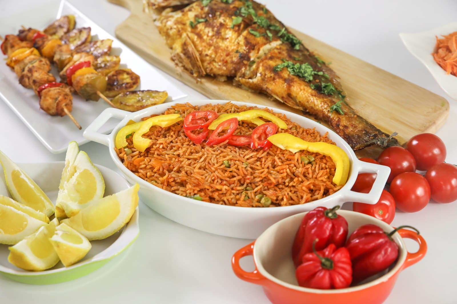 Jollof rice with fish and pepper on the side